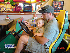 Dave and Hunter play a racing game.