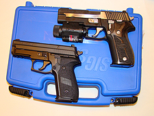 Pictured with the Sig P229
