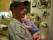 Hunter naps on daddy's shoulder.