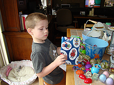 Hunter opening an Easter gift.