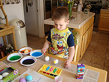 Hunter coloring eggs