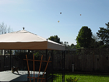 Hot air balloons over the gazebo.