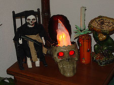 Grim Reaper and flaming skull.