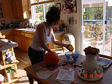 Heidi carving pumpkins.
