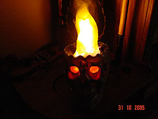 Flaming skull in the dark.