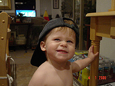 Hunter wearing daddy's hat.