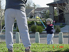 Hunter and daddy practice their swing