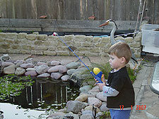 Hunter practice fishing in the pond.
