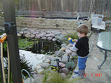 Hunter practice fishing in the pond.