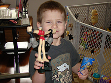 Hunter showing his new Batman action figure set.