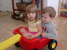 Hunter and Jordan get a ride in the wagon from Tanya.