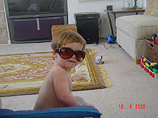 Hunter wearing mommy's big sunglasses.