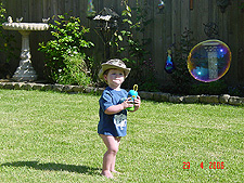 Hunter blowing bubbles.