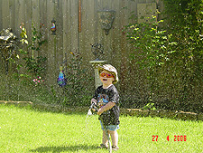 Hunter loves to play with the hose.
