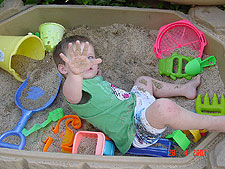 Hunter playing in his sand box.