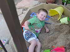 Hunter playing in his sand box.