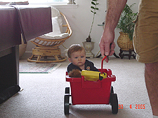 Hunter takes a ride in his new wagon.