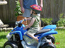 Hunter riding his ATV