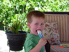 Hunter cools off with a popsicle.