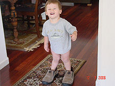Hunter loves to wear daddy's shoes.