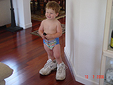 Hunter wearing daddy's shoes.