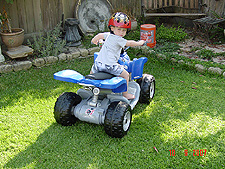 Hunter riding his ATV.