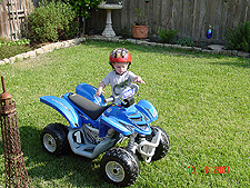 Hunter riding his ATV.