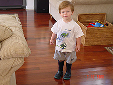 Hunter wearing his favorite rain boots from his cousin, Tyler.