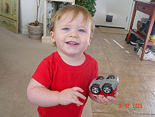 Hunter plays with his car.