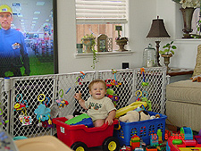 Hunter loves to sit in his wagon -- even with the toys in it.