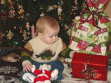 Hunter trying to open a present early.
