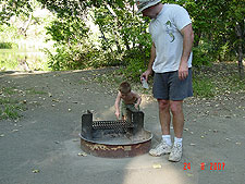 Dave and Hunter chase a lizzard around the firepit.