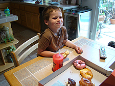 Hunter enjoying a donut.