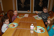The kids eating dinner.