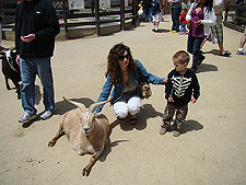 Heidi and Hunter with a goat
