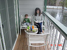 Hunter and Heidi eat lunch on the balcony.