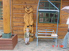 Hunter by a big bear.