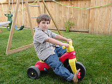 Tyler on his three-wheeler.