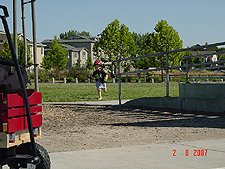 Hunter hits balls with daddy.