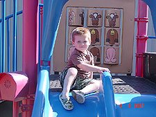 Hunter going down the slide.