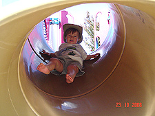 Hunter going down the slide.