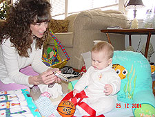Looking at the pretty personalized ornament from aunt Andie and Uncle Dan.