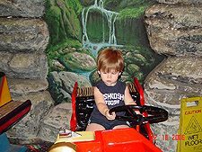 Hunter takes a ride on a fire truck.